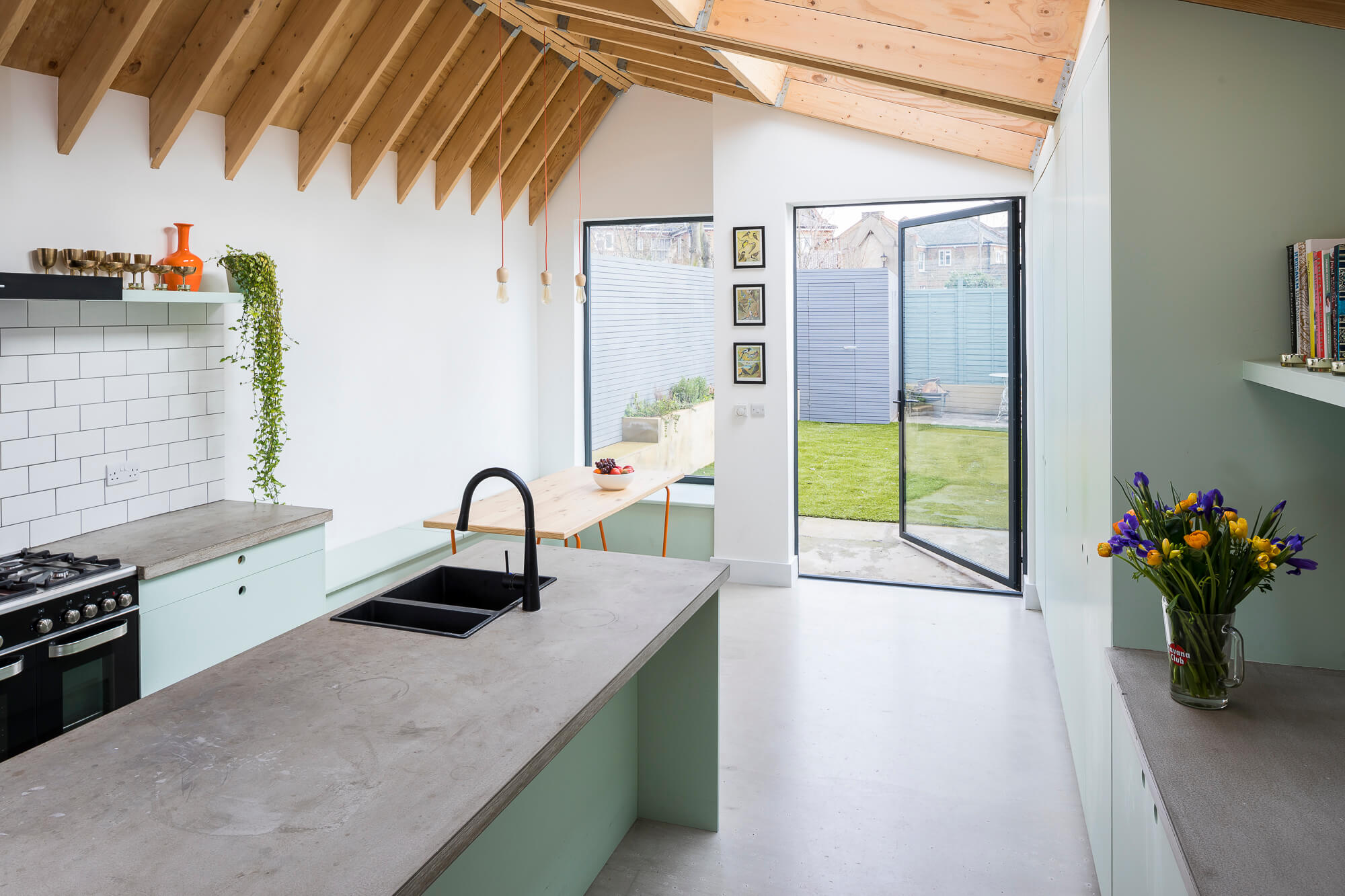 Modern kitchen with mint green cabinets