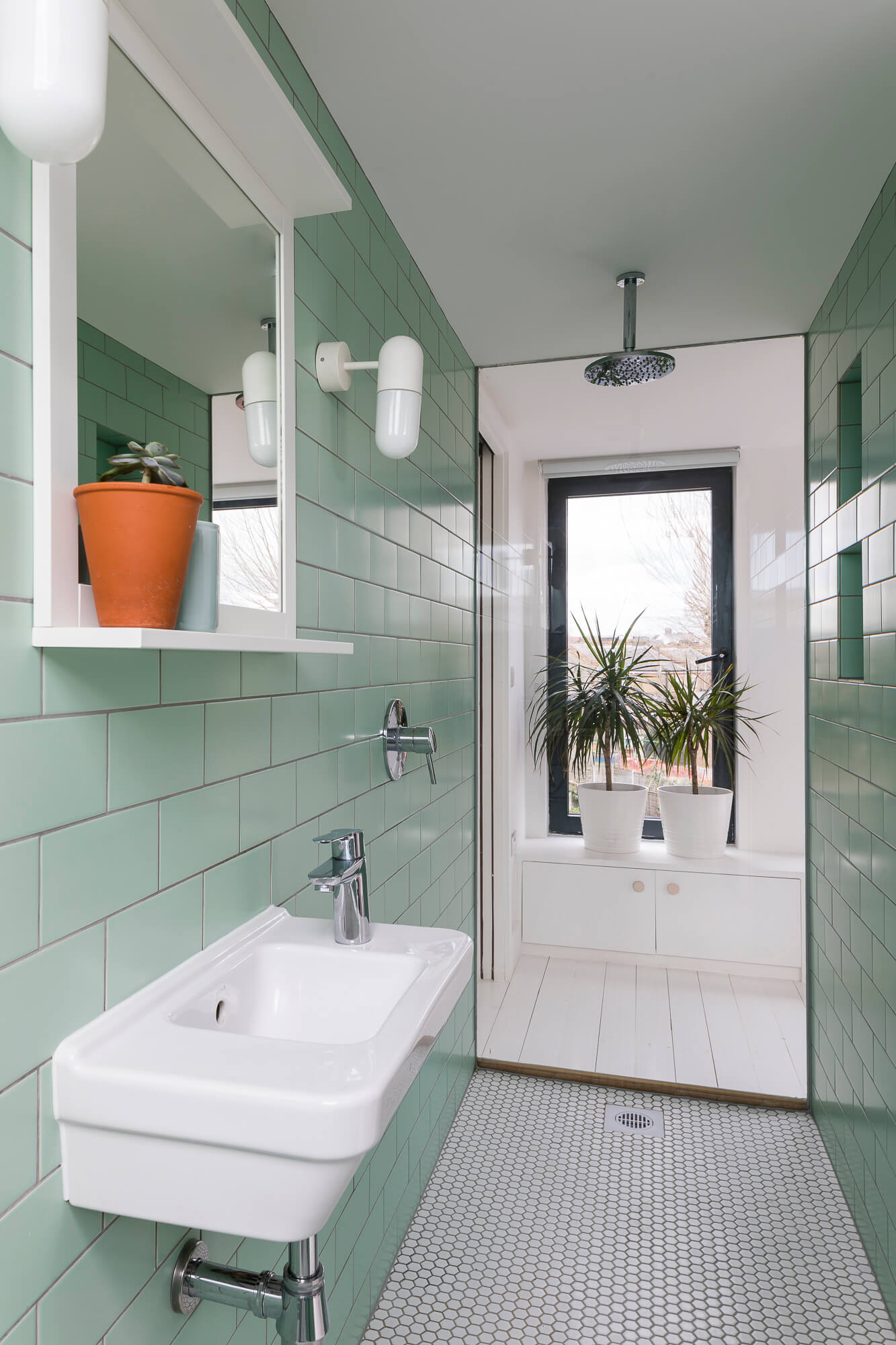 Bathroom with mint green tiles