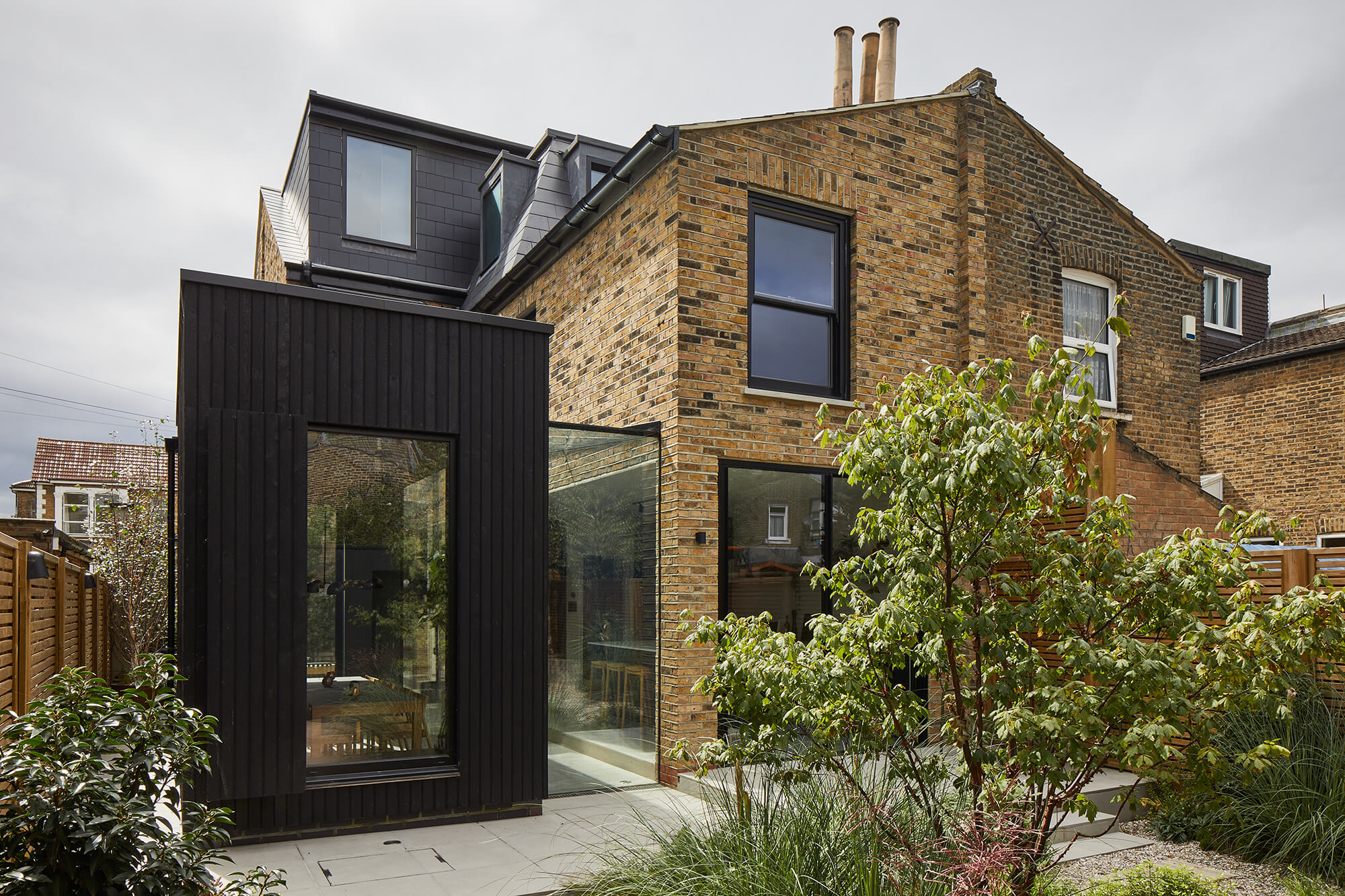 Modern extension with black timber cladding