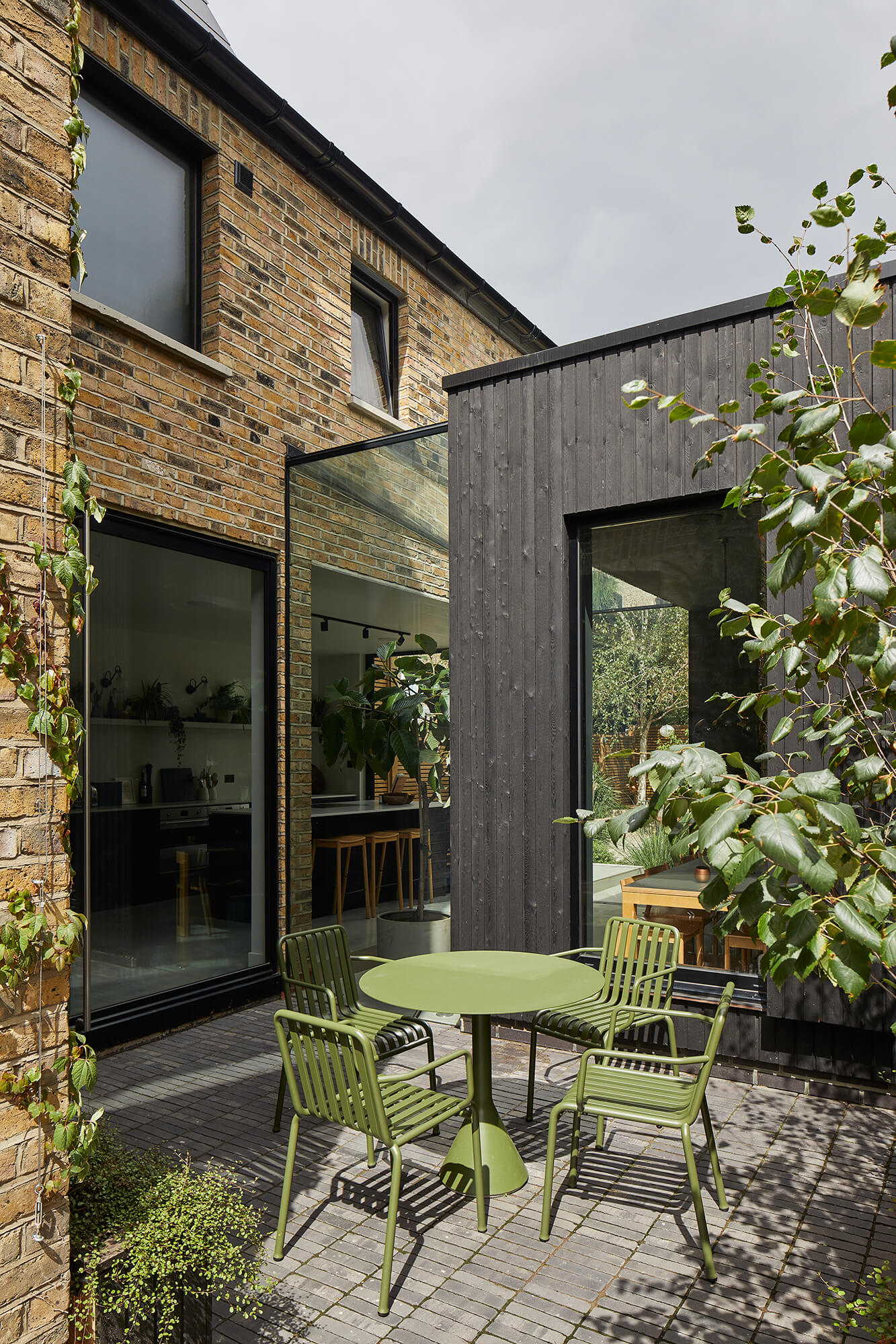 Outdoor terrace with green metal furniture